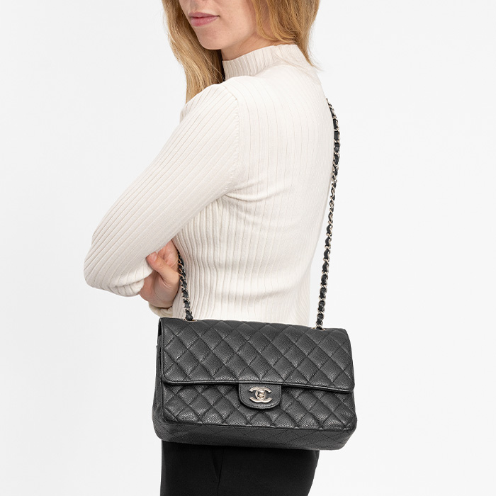 model wearing the chanel double flap as a crossbody bag FASHIONPHILE