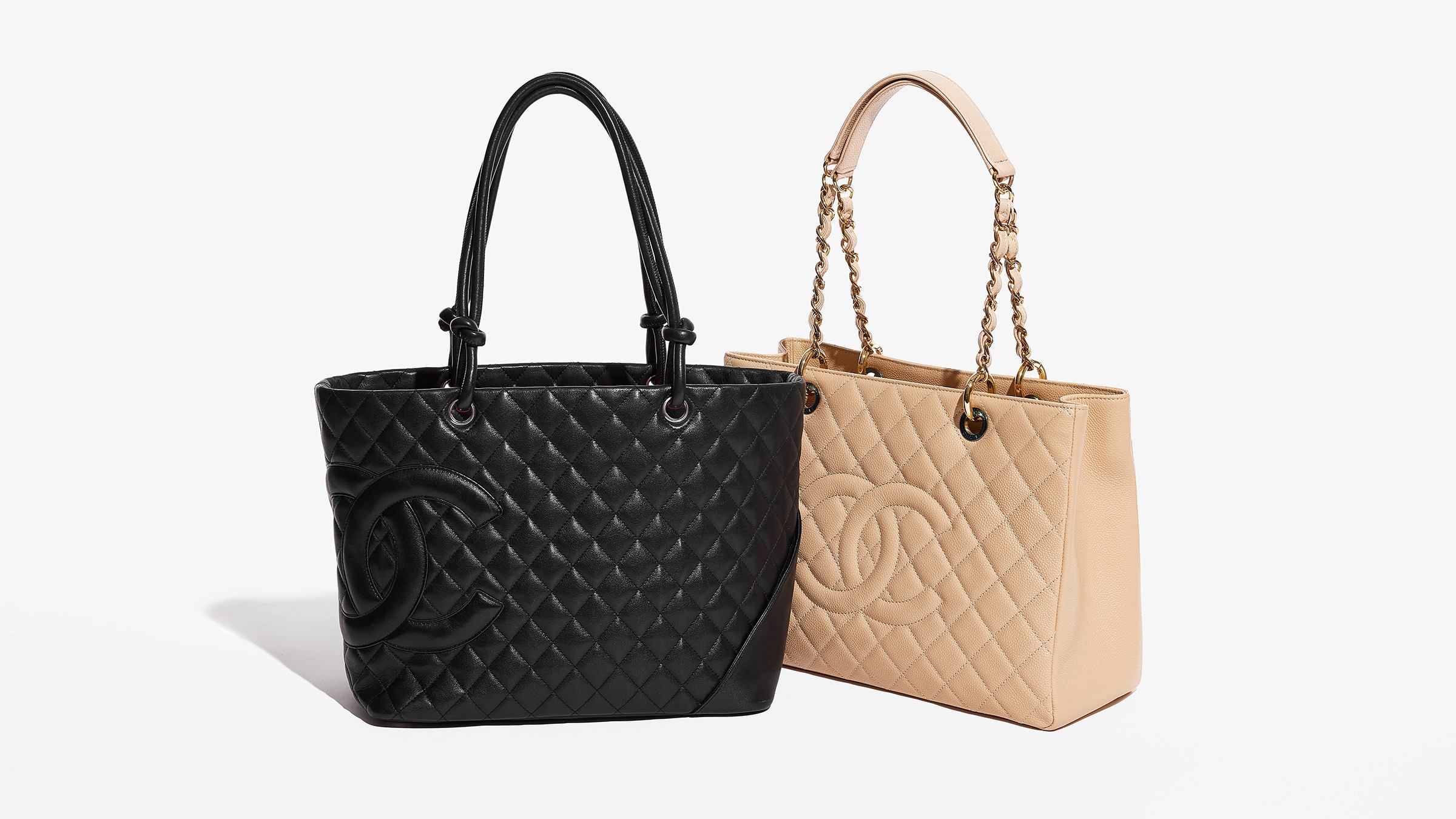 two discontinued chanel handbag styles side by side including the chanel cambon tote in black and the beige grand shopping tote by FASHIONPHILE